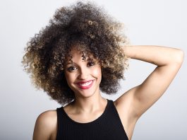 Beautiful smiling woman with curly hair