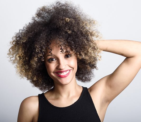 Beautiful smiling woman with curly hair