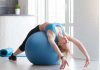 Fit sportswoman doing pilates with stability ball