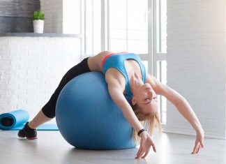 Benefits of Using a Stability Ball in Your Training Fit sportswoman doing pilates with stability ball