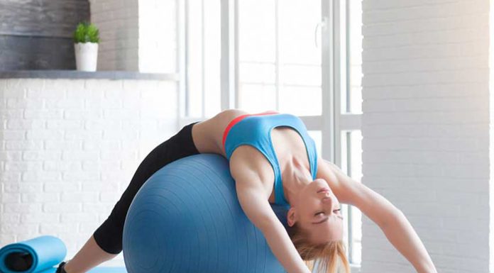 Benefits of Using a Stability Ball in Your Training Fit sportswoman doing pilates with stability ball